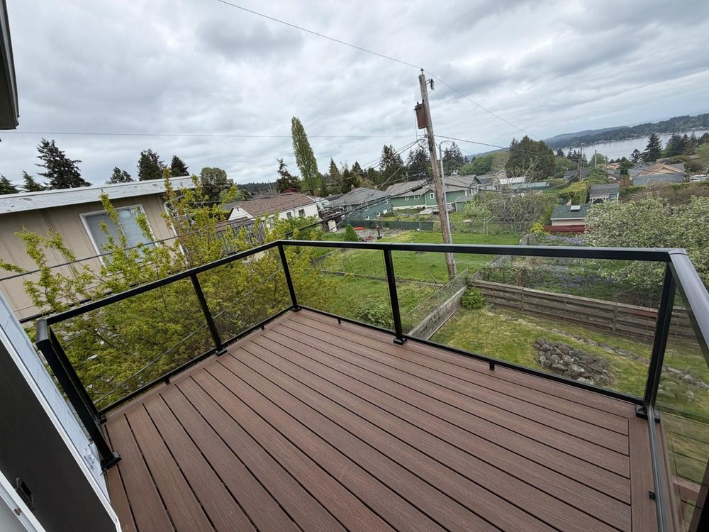 Elevated composite deck with glass railing and water view, Redmond WA